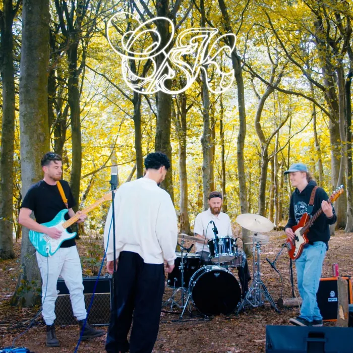 Care Package Live Session cover: the band playing in a sunlit autumn wood, white OSK tag above.